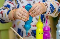 human-person-squeezing-bottle-on-a-container-finger-finger-image.jpg